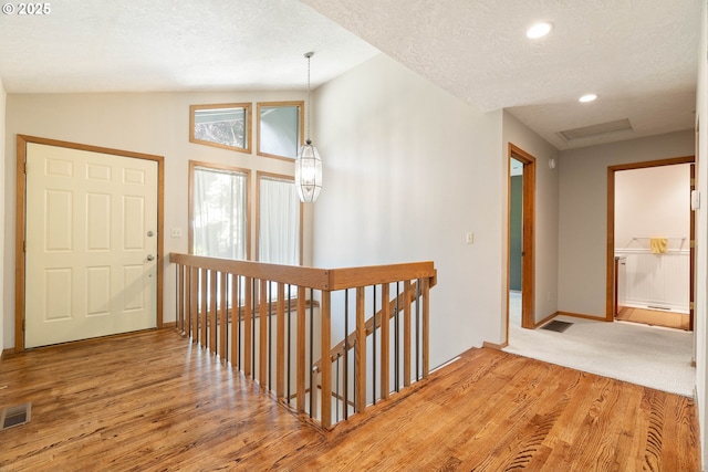 4740 SW Lowell Ct, Portland, OR 97221 - entryway with wood finished floors, a textured ceiling, and recessed lighting