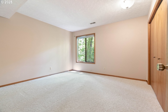 4740 SW Lowell Ct, Portland, OR 97221 - empty room with light colored carpet and a textured ceiling