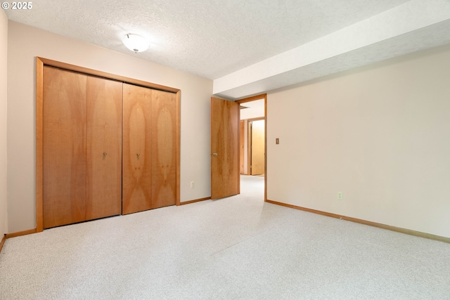 4740 SW Lowell Ct, Portland, OR 97221 - unfurnished bedroom featuring a closet and a textured ceiling
