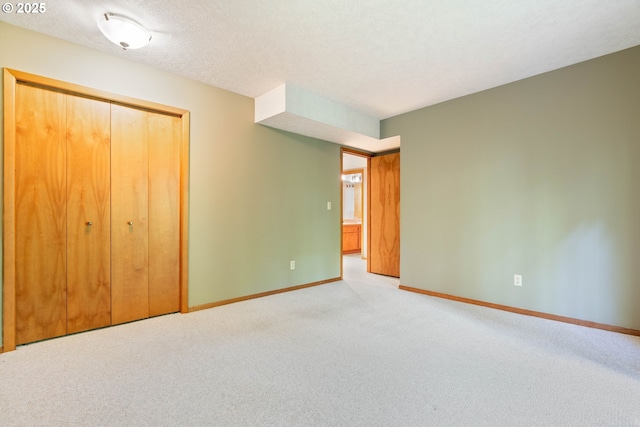 4740 SW Lowell Ct, Portland, OR 97221 - unfurnished bedroom featuring carpet, a closet, and a textured ceiling