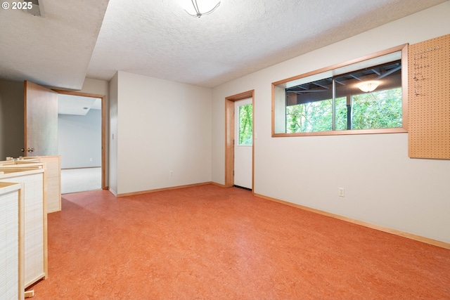 4740 SW Lowell Ct, Portland, OR 97221 - empty room with light colored carpet and a textured ceiling