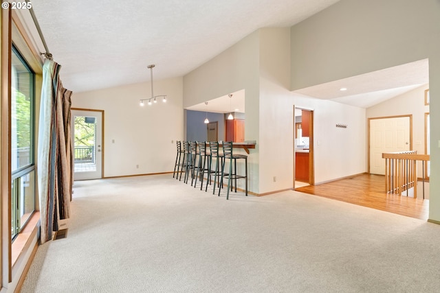 4740 SW Lowell Ct, Portland, OR 97221 - unfurnished room featuring lofted ceiling and light carpet