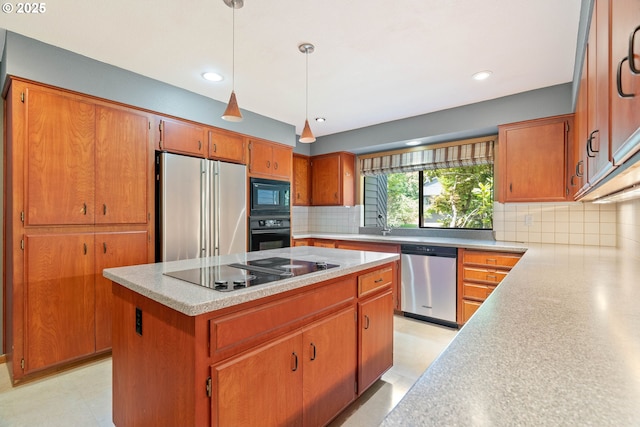 4740 SW Lowell Ct, Portland, OR 97221 - kitchen with black appliances, a kitchen island, tasteful backsplash, brown cabinetry, and recessed lighting
