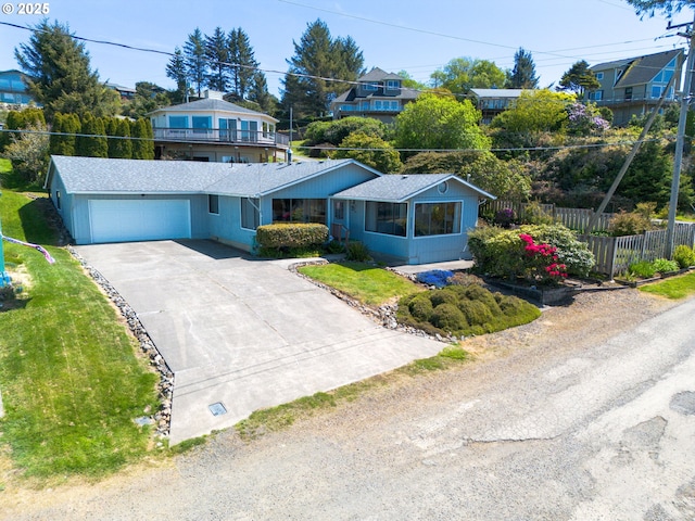 35565 Lower Loop Rd, Pacific City, OR 97135 - view of front facade featuring driveway and an attached garage