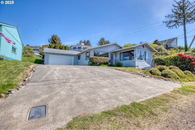 35565 Lower Loop Rd, Pacific City, OR 97135 - ranch-style home with driveway and a garage