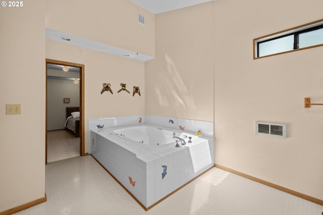 35565 Lower Loop Rd, Pacific City, OR 97135 - ensuite bathroom featuring a jetted tub, baseboards, and tile patterned floors