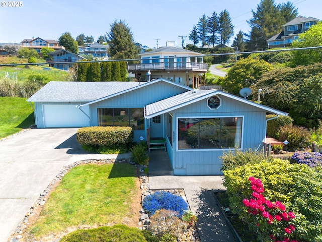 35565 Lower Loop Rd, Pacific City, OR 97135 - view of front of home with a garage and concrete driveway