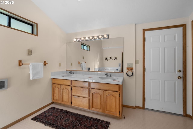 35565 Lower Loop Rd, Pacific City, OR 97135 - full bathroom featuring double vanity, baseboards, and lofted ceiling
