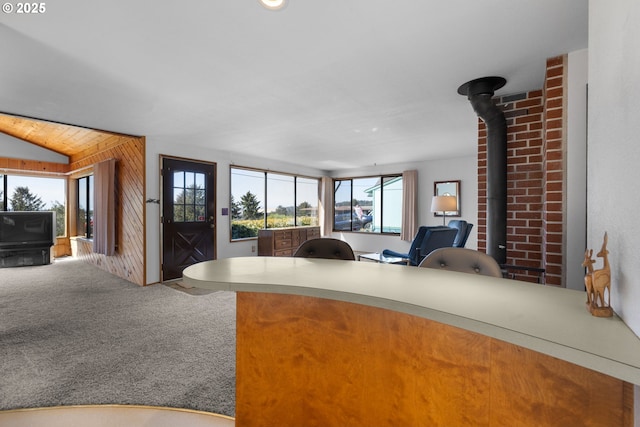 35565 Lower Loop Rd, Pacific City, OR 97135 - carpeted living room featuring a desk and a wood stove