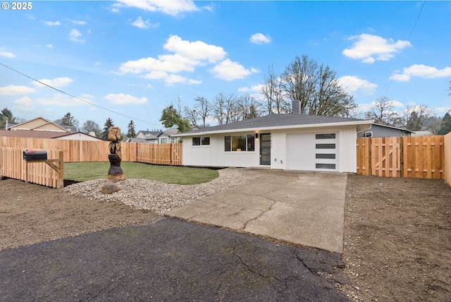 view of front facade with a front yard and a garage