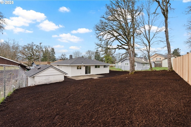 view of side of property with a patio area