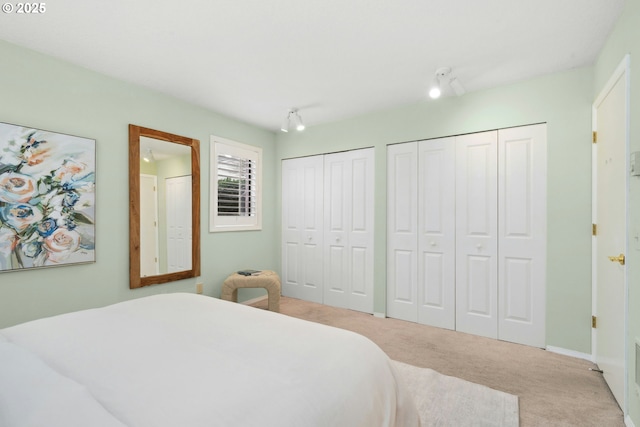 16146 SW 130th Ter Unit 2, Portland, OR 97224 - bedroom with carpet and multiple closets