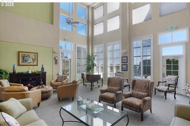 16146 SW 130th Ter Unit 2, Portland, OR 97224 - living area featuring carpet floors, a high ceiling, plenty of natural light, and ceiling fan