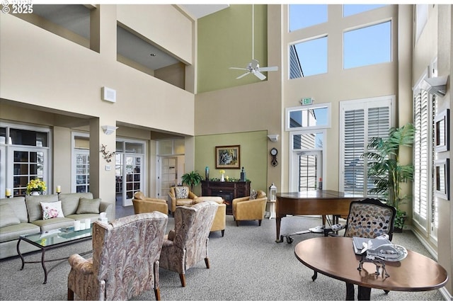 16146 SW 130th Ter Unit 2, Portland, OR 97224 - living area with healthy amount of natural light, a towering ceiling, carpet flooring, and a ceiling fan