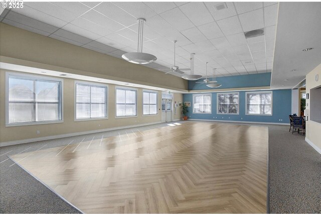16146 SW 130th Ter Unit 2, Portland, OR 97224 - unfurnished room with baseboards, a high ceiling, and a paneled ceiling