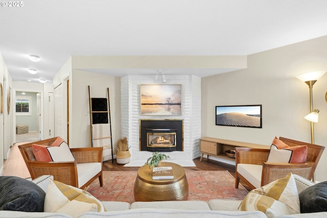 16146 SW 130th Ter Unit 2, Portland, OR 97224 - living area featuring a brick fireplace and wood finished floors