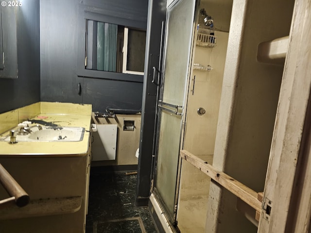 bathroom featuring a stall shower and vanity