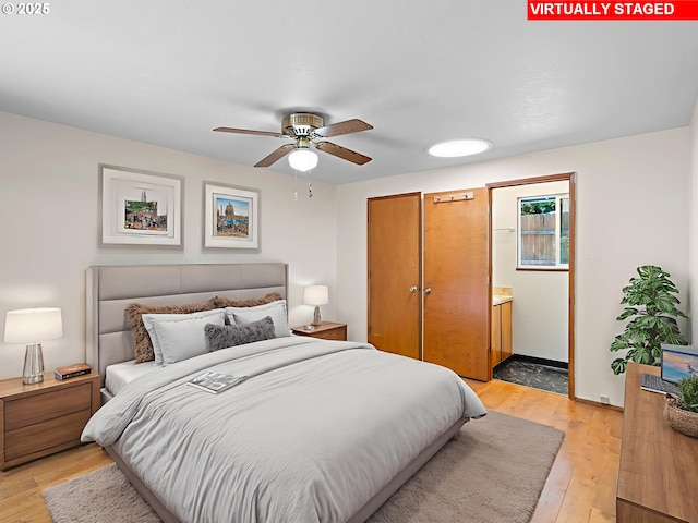 8275 SW Chestnut St, Portland, OR 97223 - bedroom with light wood-style flooring and connected bathroom