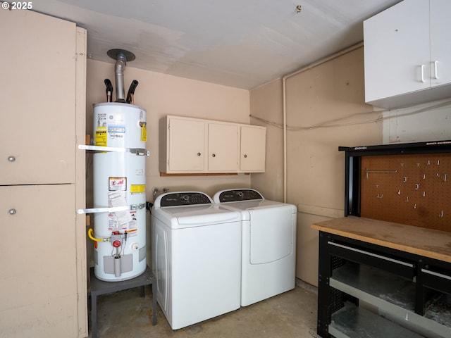 8275 SW Chestnut St, Portland, OR 97223 - laundry room featuring water heater, washer and clothes dryer, and cabinet space