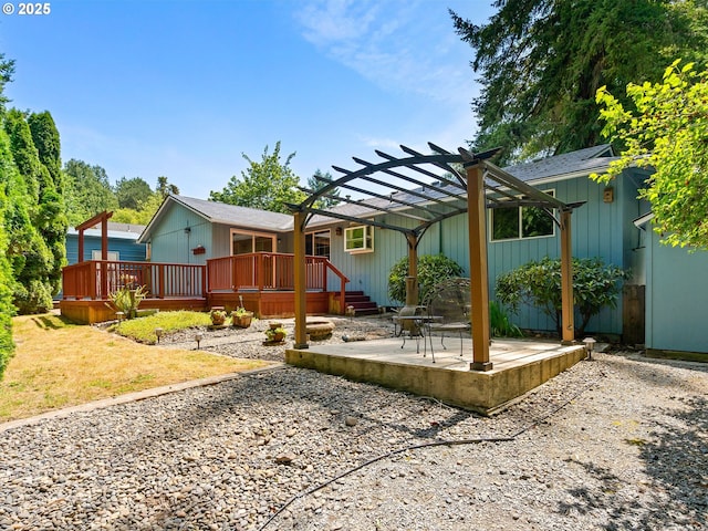 8275 SW Chestnut St, Portland, OR 97223 - rear view of house featuring a pergola, a wooden deck, and a patio area