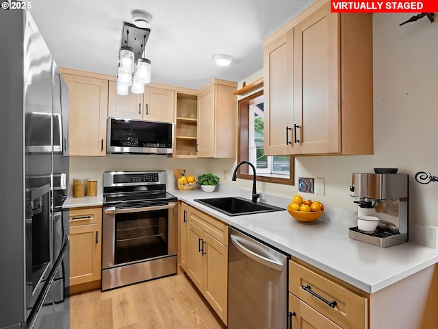 8275 SW Chestnut St, Portland, OR 97223 - kitchen featuring stainless steel appliances, light brown cabinets, and light countertops