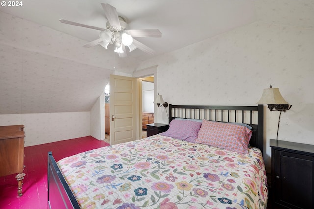 bedroom with a ceiling fan, vaulted ceiling, and wallpapered walls