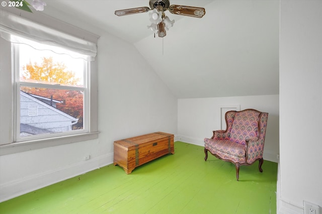 living area featuring baseboards, a ceiling fan, wood finished floors, and lofted ceiling