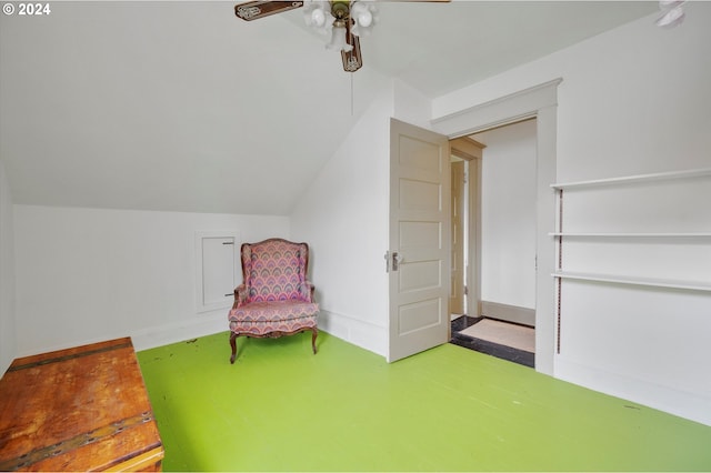 sitting room with a ceiling fan and lofted ceiling