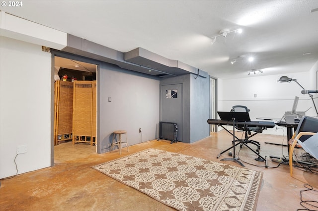 home office with concrete flooring