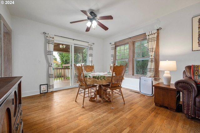 dining area featuring baseboards, plenty of natural light, light wood finished floors, and ceiling fan