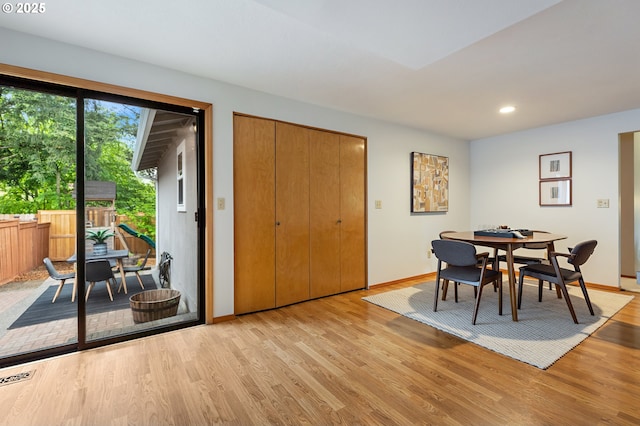 dining room featuring recessed lighting, baseboards, visible vents, and light wood-style floors