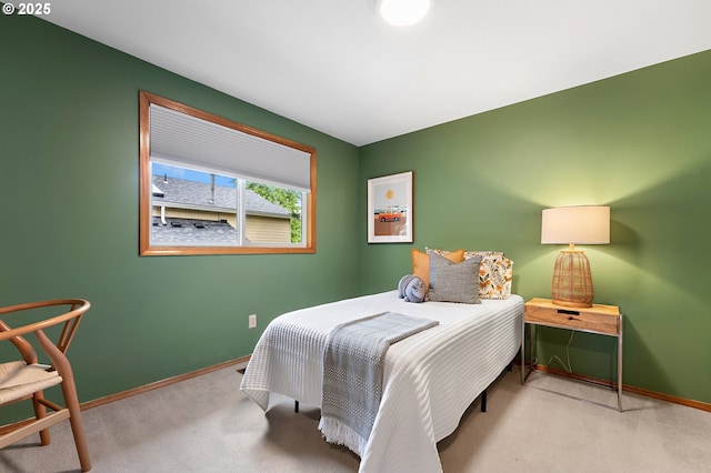 carpeted bedroom featuring baseboards