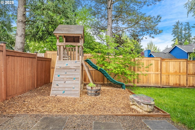 view of playground featuring a fenced backyard