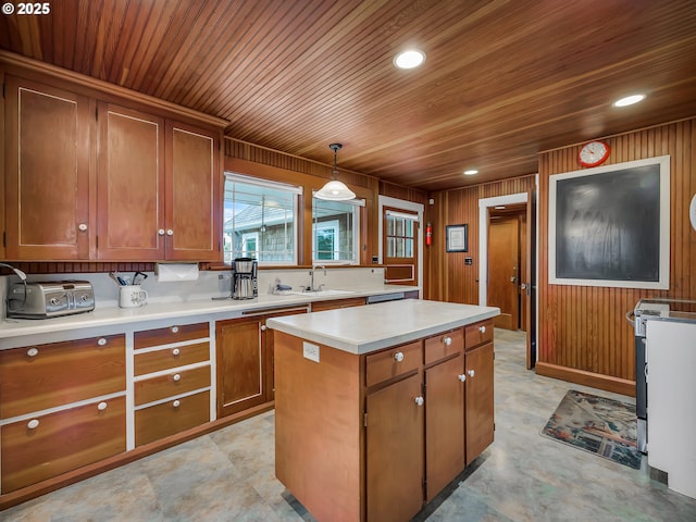 1021 S Prom, Seaside, OR 97138 - kitchen with a sink, a center island, wooden ceiling, brown cabinetry, and light countertops
