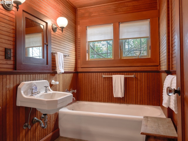 1021 S Prom, Seaside, OR 97138 - full bath featuring plenty of natural light, wood walls, and a tub