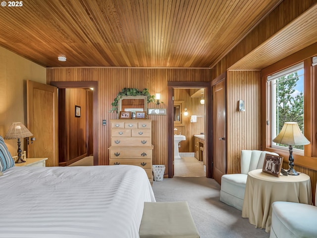 1021 S Prom, Seaside, OR 97138 - bedroom featuring wooden ceiling, light carpet, wooden walls, and connected bathroom