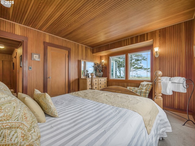 1021 S Prom, Seaside, OR 97138 - bedroom with wood ceiling, wood walls, and carpet