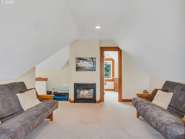 1021 S Prom, Seaside, OR 97138 - carpeted living room featuring a glass covered fireplace, lofted ceiling, baseboards, and recessed lighting