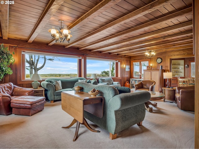 1021 S Prom, Seaside, OR 97138 - living area with a chandelier, wood ceiling with exposed beams, carpet, and wooden walls