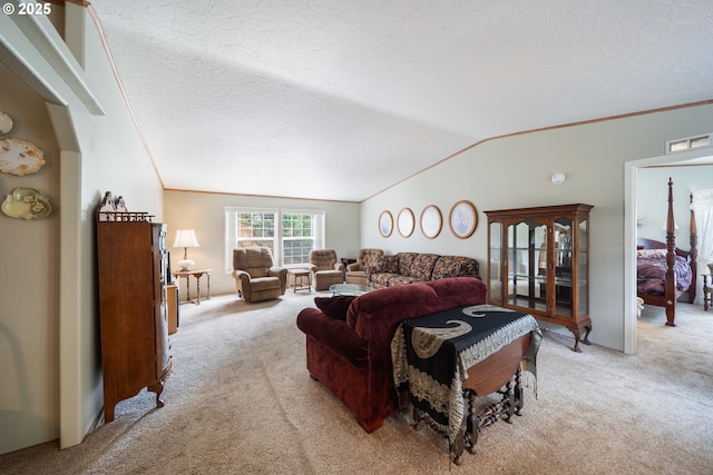 living area featuring carpet flooring, a textured ceiling, and vaulted ceiling
