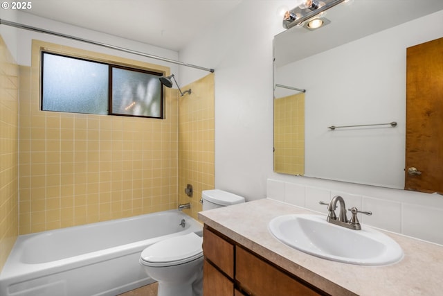 bathroom with vanity, toilet, bathing tub / shower combination, and tasteful backsplash