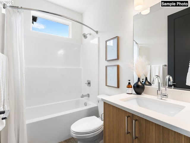 full bathroom featuring vanity, shower / bath combo, and toilet