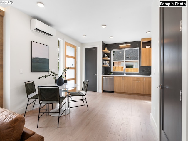 kitchen featuring an AC wall unit, open shelves, plenty of natural light, and stainless steel dishwasher