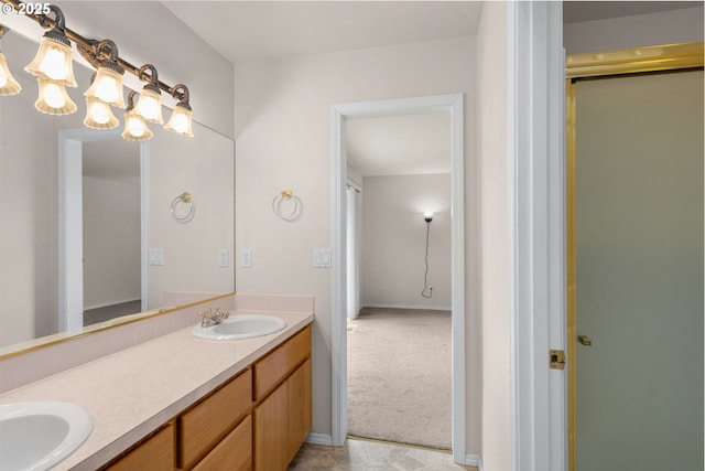 full bathroom with an enclosed shower, double vanity, and a sink