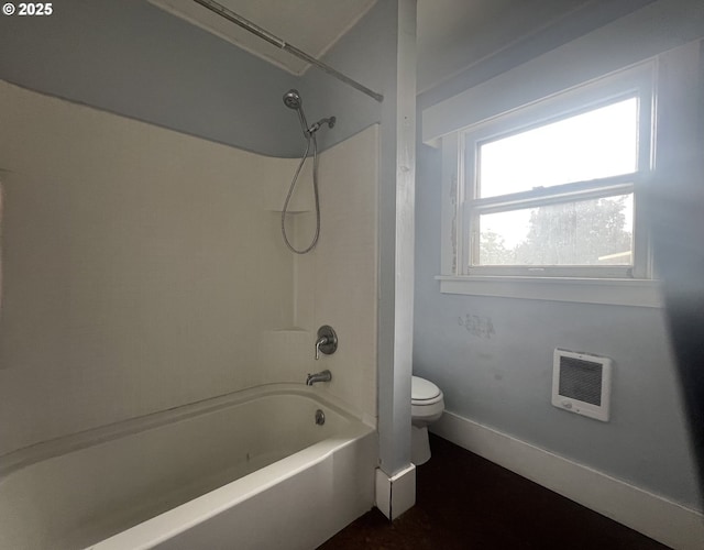 103 NW 10th Ave, Milton-Freewater, OR 97862 - full bathroom featuring heating unit, toilet, shower / tub combination, and baseboards