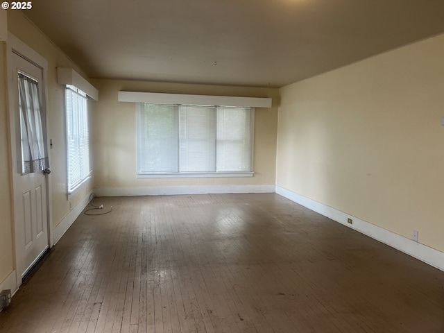 103 NW 10th Ave, Milton-Freewater, OR 97862 - empty room with baseboards and hardwood / wood-style floors