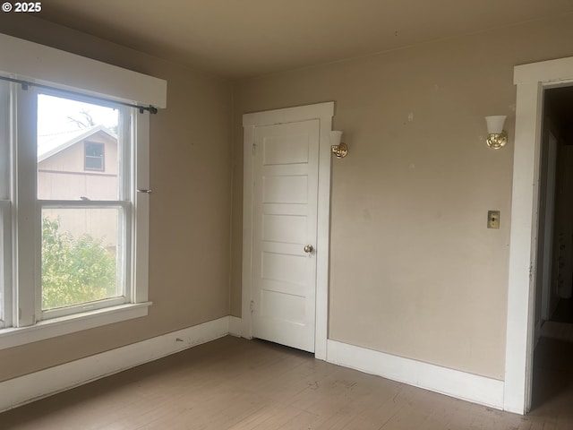 103 NW 10th Ave, Milton-Freewater, OR 97862 - empty room with light wood-style floors and baseboards
