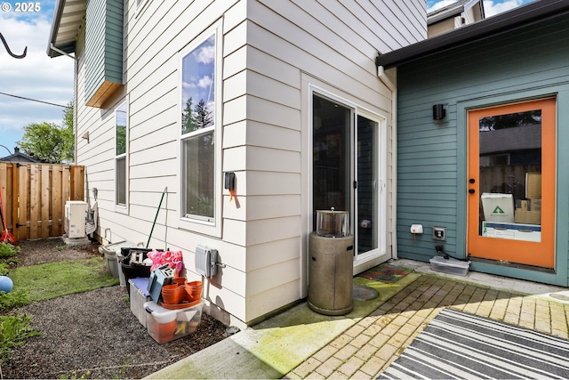exterior space featuring ac unit and fence