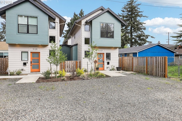view of front of house featuring fence