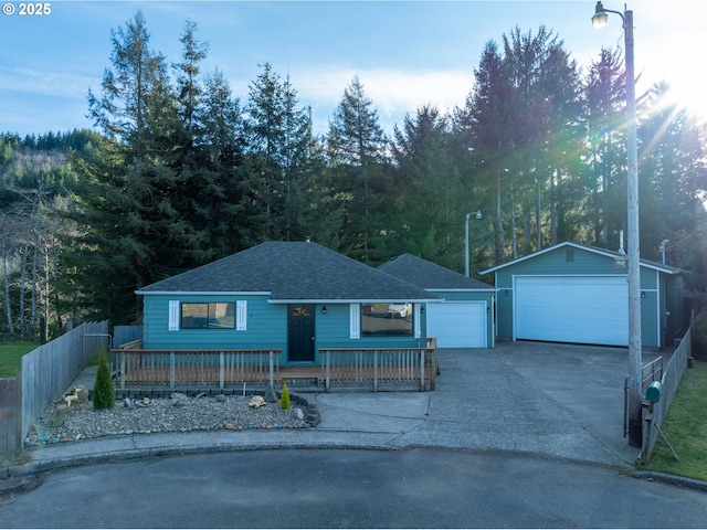 ranch-style home featuring an outbuilding and a garage